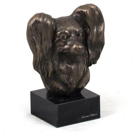 Papillon statue on marble base